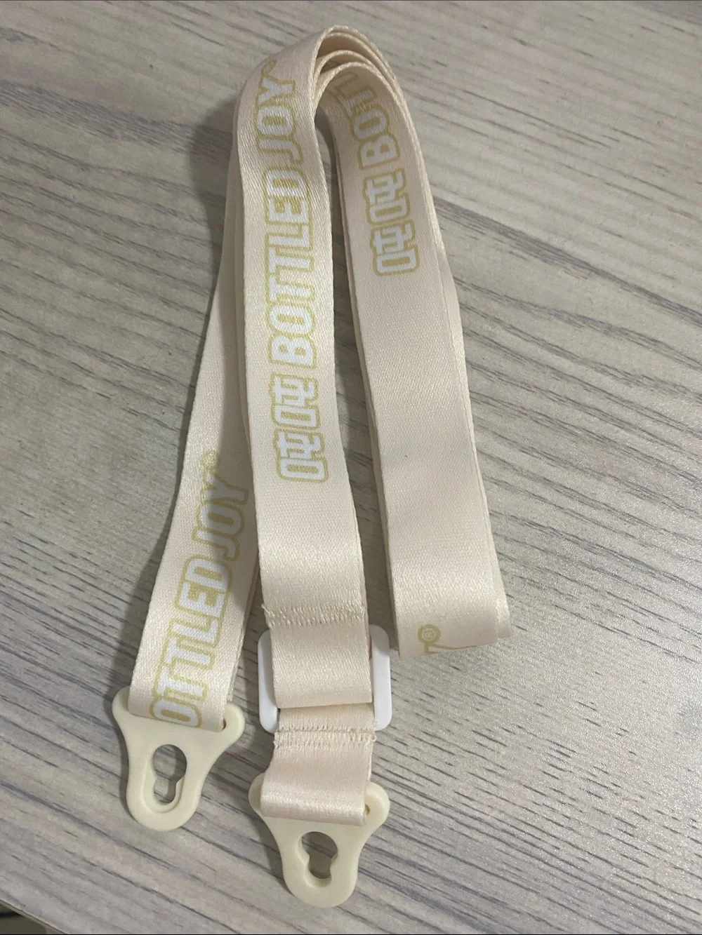 Bottled Joy Cream Strap